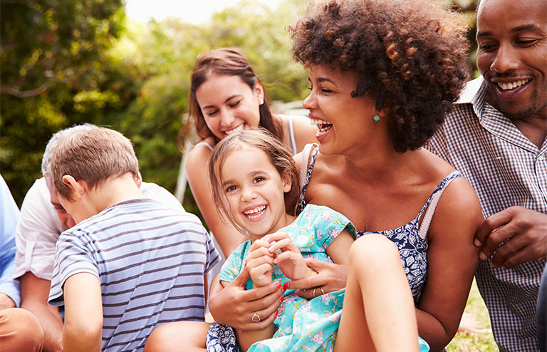 Photo of families having fun together outdoors