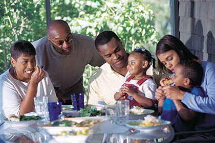 Photo of a family eating a meal together