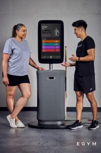 A trainer and a trainee reviewing her BioAge metrics.