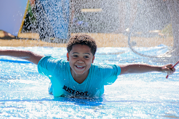 Photo of a kid on a water slide