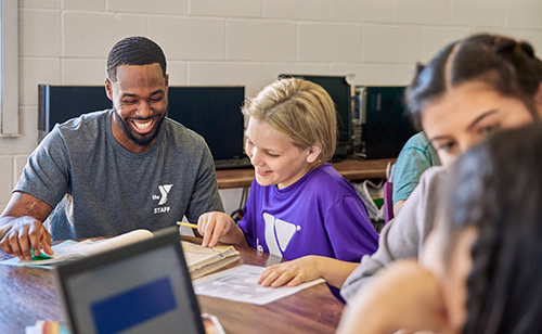 staff working with children in after-school care