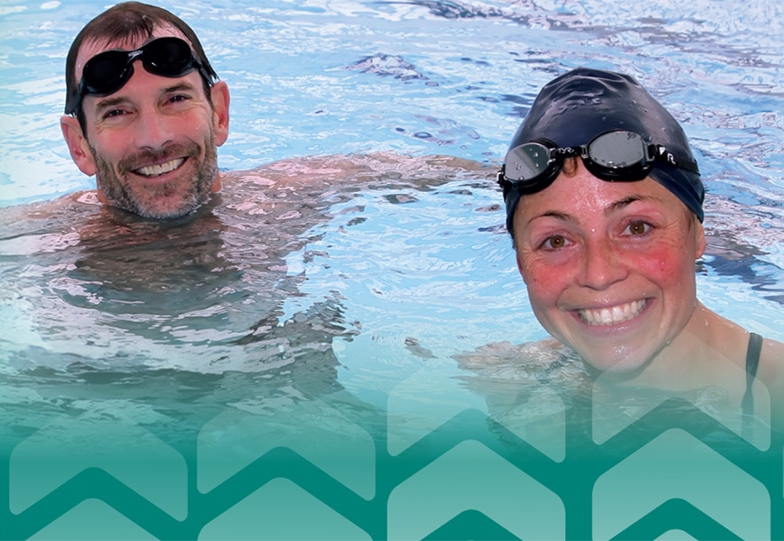 two people swimming in the pool