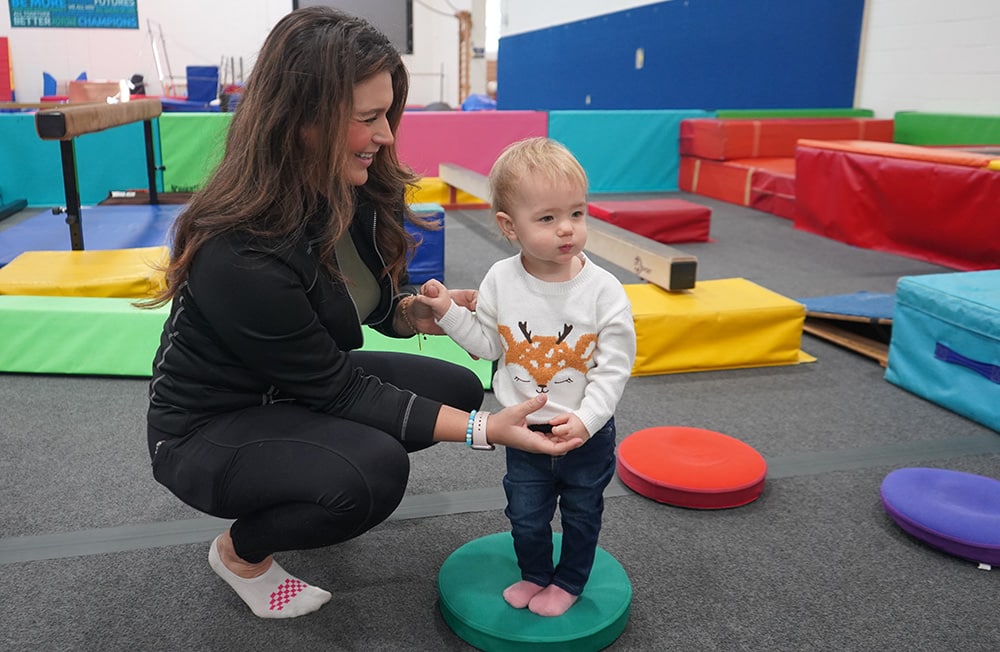 mom and child in gymnastics class