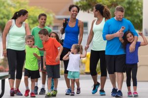 group of people walking into the Y